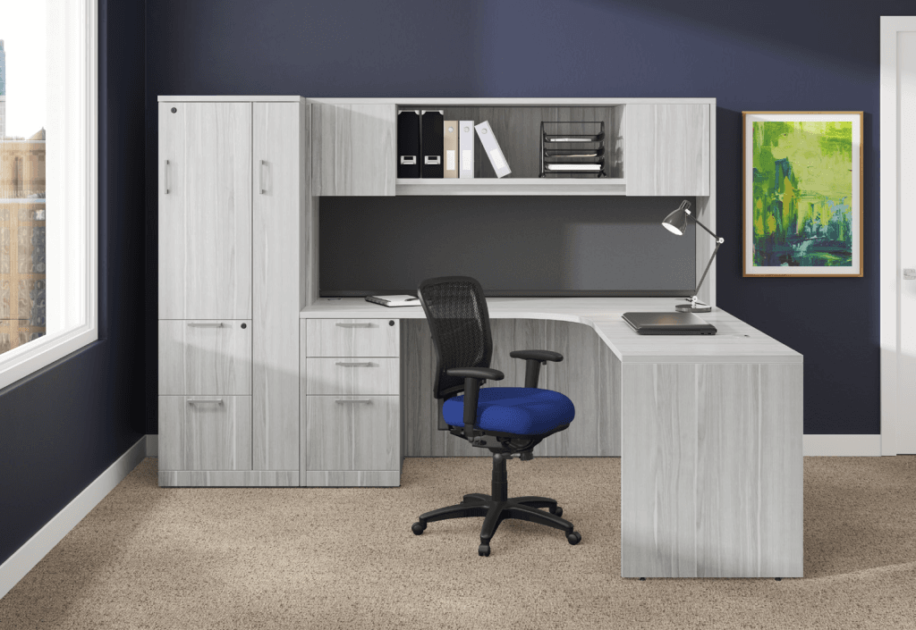 Modern office desk with chair and storage cabinets.